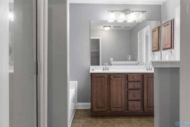 29929 Park Hill Dr, Madison, AL 35757 - full bath featuring double vanity, tile patterned flooring, baseboards, and a bathtub
