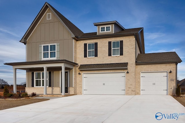 view of front of property featuring a garage and a porch