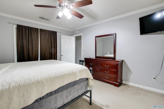 bedroom with visible vents, light carpet, baseboards, and crown molding