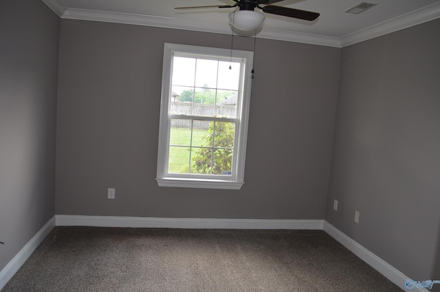spare room with a ceiling fan, carpet, ornamental molding, and baseboards