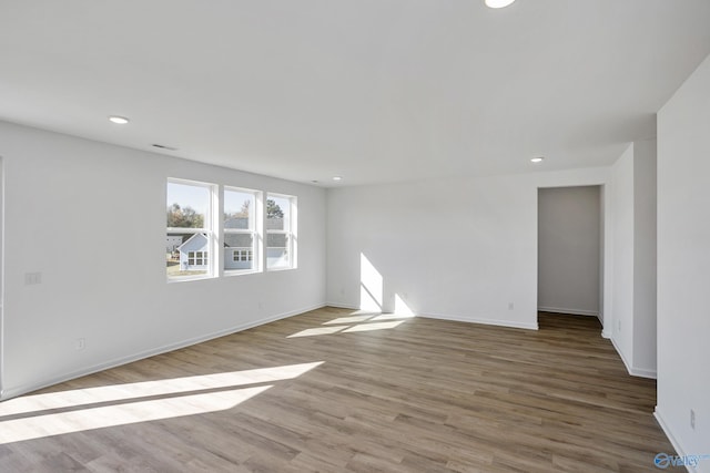 unfurnished room featuring light hardwood / wood-style floors