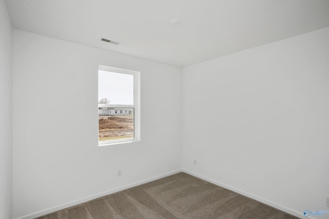 spare room featuring carpet floors