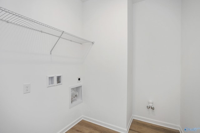 laundry room featuring hookup for a gas dryer, electric dryer hookup, hardwood / wood-style flooring, and washer hookup