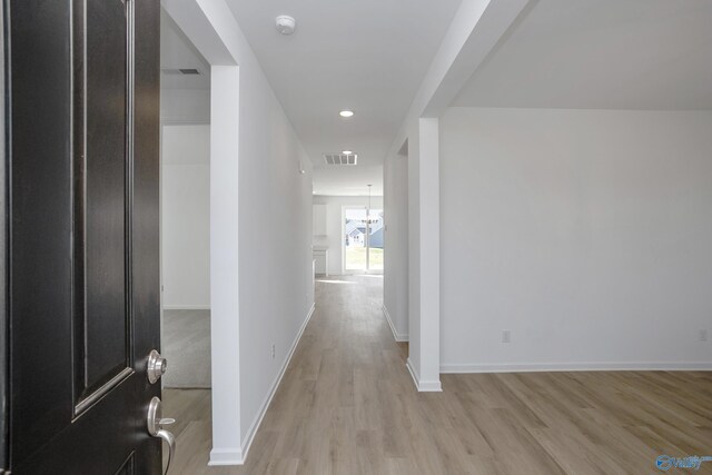 corridor featuring light hardwood / wood-style flooring