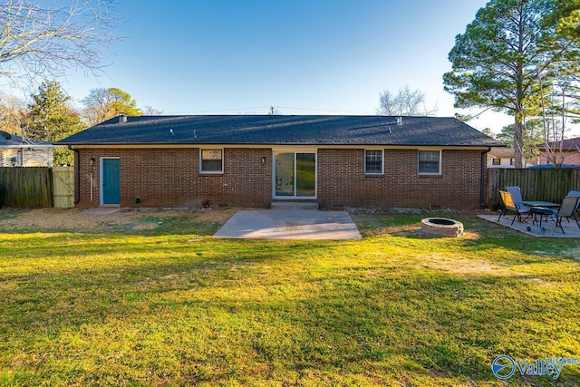 back of property featuring crawl space, an outdoor fire pit, fence, and a patio