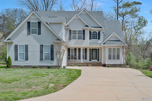 view of front facade with driveway, crawl space, a shingled roof, and a front lawn