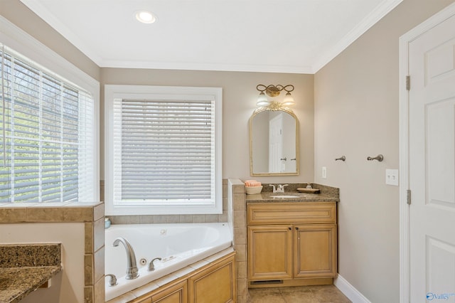 bathroom with baseboards, ornamental molding, tile patterned floors, vanity, and a jetted tub