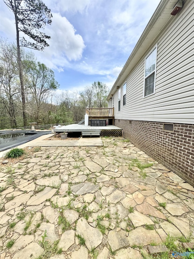 view of patio / terrace featuring a wooden deck
