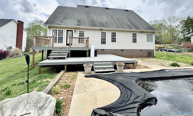 back of house with crawl space, fence, and a wooden deck