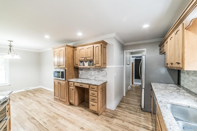 2600 Gawain Rd SE, Huntsville, AL 35803 - kitchen featuring appliances with stainless steel finishes, backsplash, light wood finished floors, ornamental molding, and light stone countertops