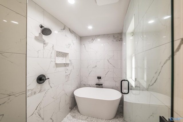 2600 Gawain Rd SE, Huntsville, AL 35803 - bathroom featuring tile walls, a shower stall, and a freestanding tub