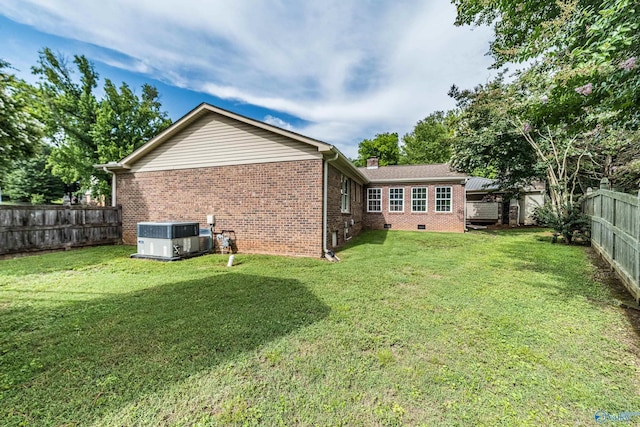 2600 Gawain Rd SE, Huntsville, AL 35803 - rear view of property featuring brick siding, a chimney, a fenced backyard, and crawl space