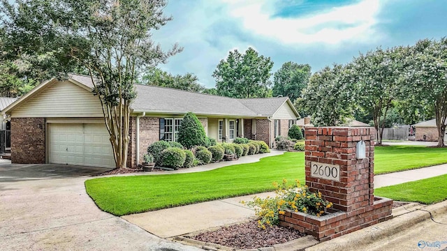 2600 Gawain Rd SE, Huntsville, AL 35803 - ranch-style house with an attached garage, brick siding, and concrete driveway