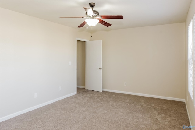 carpeted empty room with ceiling fan