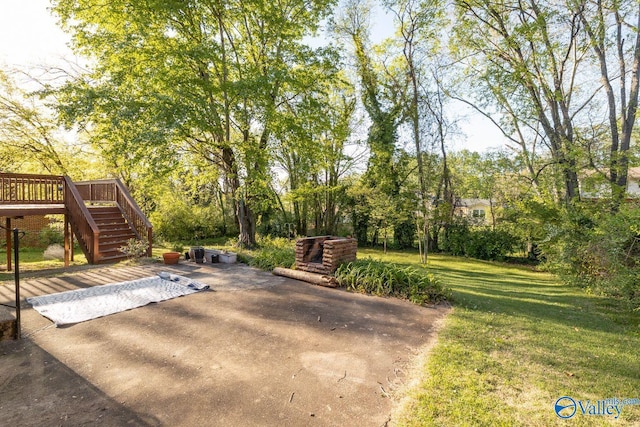 view of patio / terrace with a deck and stairs