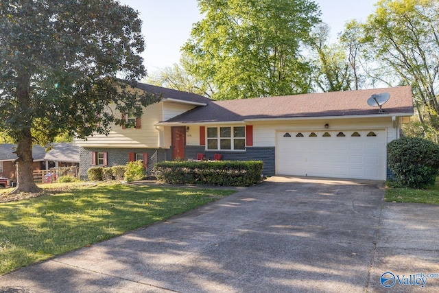 split level home with a garage, brick siding, driveway, and a front lawn