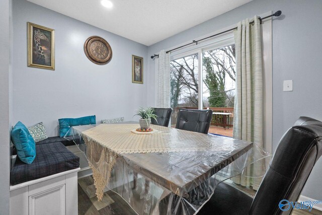 dining room featuring wood finished floors and recessed lighting