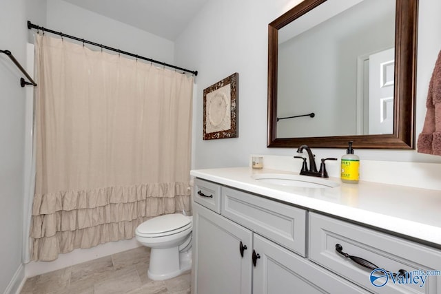 full bathroom with toilet, curtained shower, and vanity