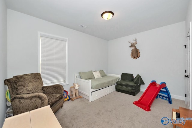 carpeted bedroom with baseboards and visible vents