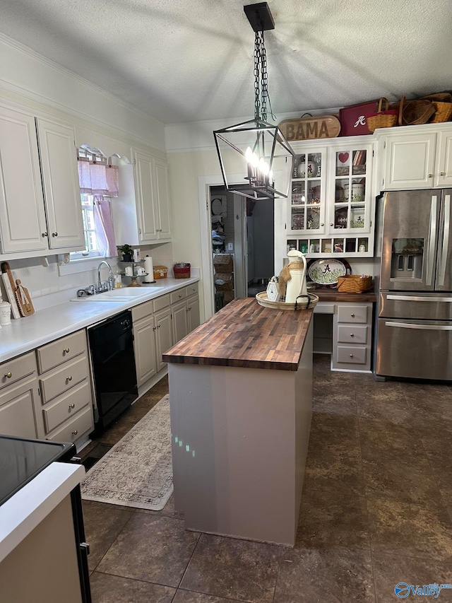 kitchen featuring butcher block counters, a kitchen island, stainless steel fridge with ice dispenser, pendant lighting, and black dishwasher