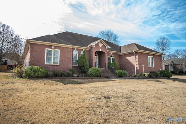 view of front of home featuring brick siding