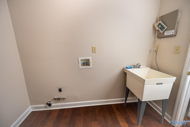 clothes washing area featuring baseboards, gas dryer hookup, laundry area, hookup for a washing machine, and wood finished floors