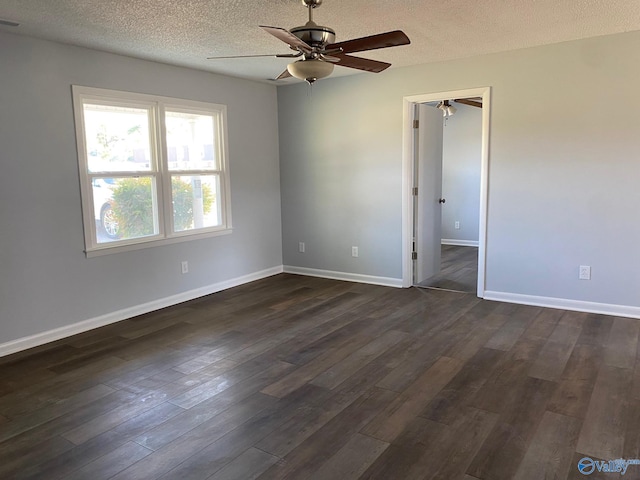 unfurnished room with ceiling fan, dark hardwood / wood-style floors, and a textured ceiling