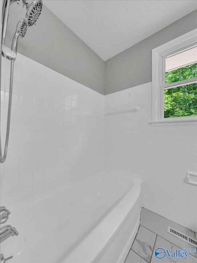 2612 Valley Brook Dr, Huntsville, AL 35811 - full bathroom featuring marble finish floors, a textured ceiling, and tub / shower combination