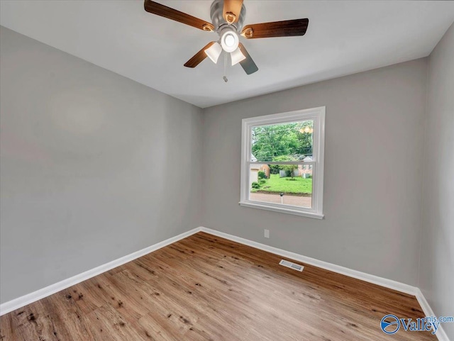 2612 Valley Brook Dr, Huntsville, AL 35811 - empty room with wood finished floors and a ceiling fan