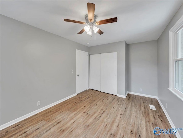 2612 Valley Brook Dr, Huntsville, AL 35811 - unfurnished bedroom featuring wood finished floors, a closet, and ceiling fan