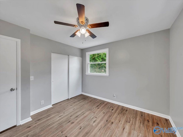 2612 Valley Brook Dr, Huntsville, AL 35811 - unfurnished bedroom with a closet, wood finished floors, and ceiling fan