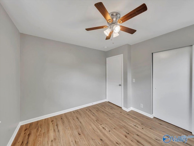2612 Valley Brook Dr, Huntsville, AL 35811 - unfurnished bedroom with wood finished floors, a closet, and a ceiling fan