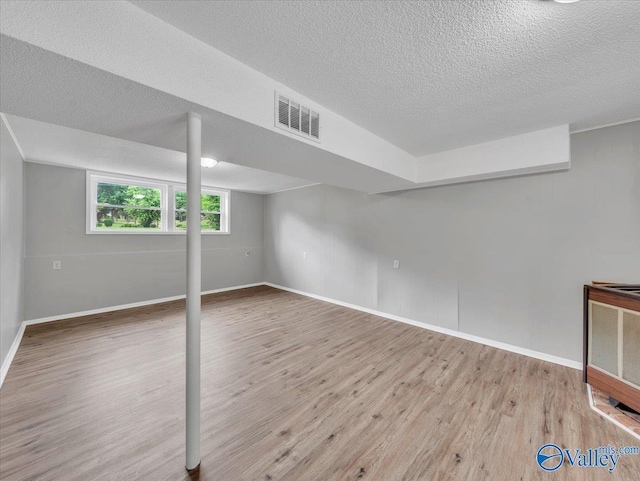 2612 Valley Brook Dr, Huntsville, AL 35811 - basement with wood finished floors and a textured ceiling