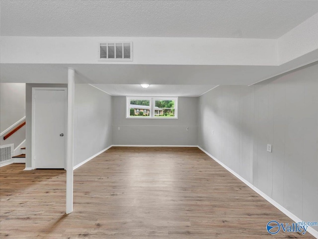 2612 Valley Brook Dr, Huntsville, AL 35811 - below grade area featuring wood finished floors and stairway