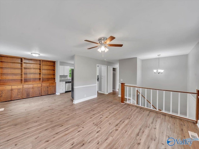 2612 Valley Brook Dr, Huntsville, AL 35811 - unfurnished living room featuring a ceiling fan, light wood finished floors, and a chandelier