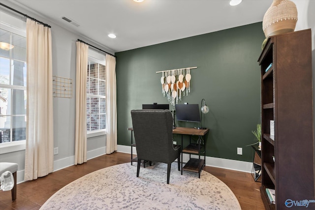 office area with dark wood-type flooring, recessed lighting, visible vents, and baseboards