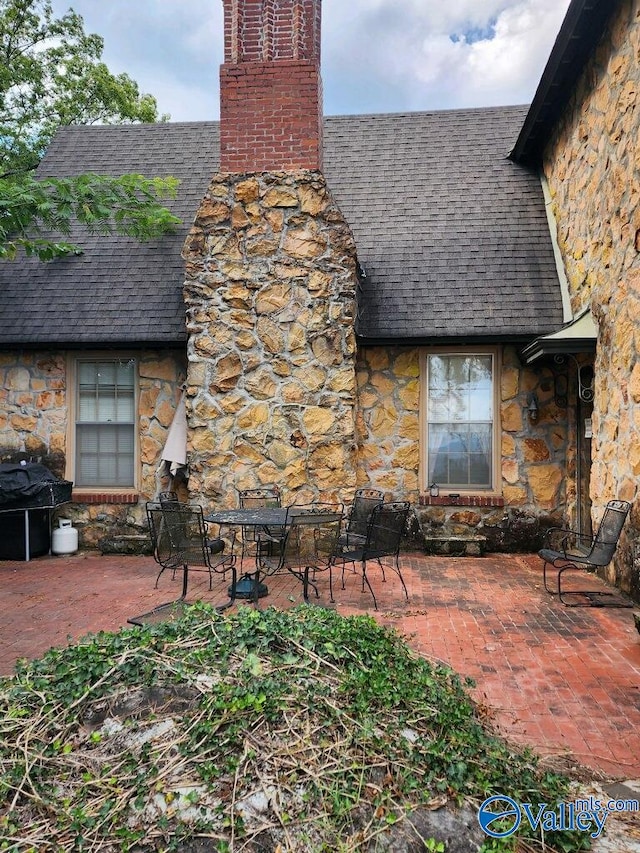 view of property exterior featuring a patio