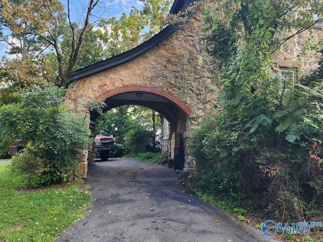 view of parking / parking lot with aphalt driveway