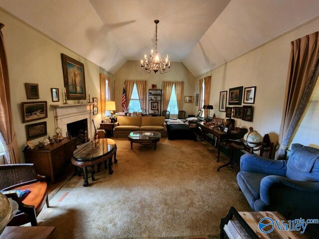 carpeted living room with a notable chandelier and vaulted ceiling