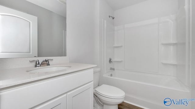 full bath featuring vanity, toilet, and bathing tub / shower combination
