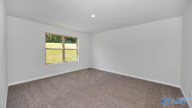unfurnished room with recessed lighting, carpet flooring, visible vents, and baseboards