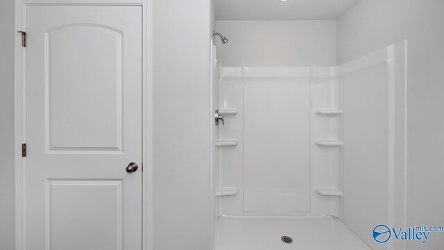 bathroom featuring walk in shower