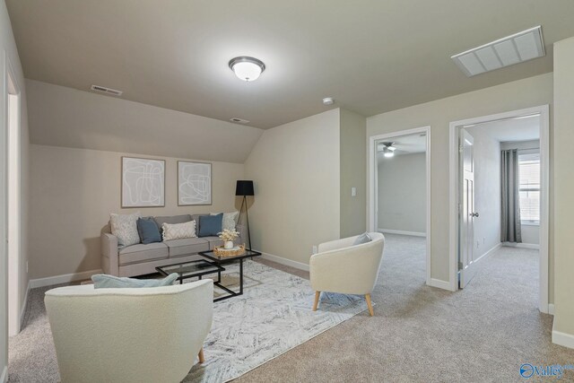 bedroom featuring ceiling fan, light colored carpet, and crown molding