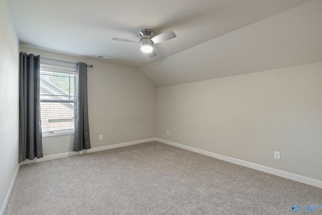 carpeted bedroom with ceiling fan, crown molding, and ensuite bathroom