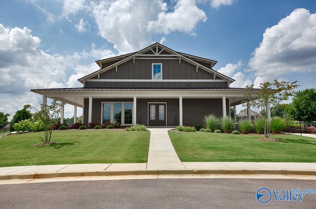 view of front of property with a front lawn and covered porch