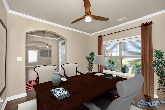 dining room with ceiling fan, dark hardwood / wood-style flooring, and crown molding