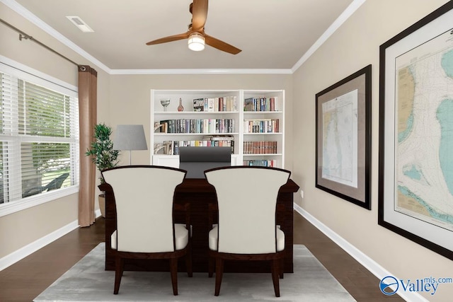 office area featuring ceiling fan, dark wood-type flooring, built in shelves, and crown molding