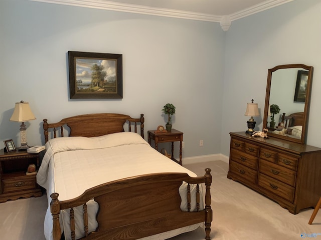 bedroom with ornamental molding, light carpet, and baseboards