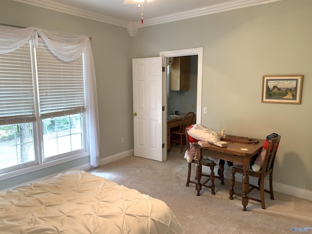 bedroom featuring light colored carpet, crown molding, and baseboards