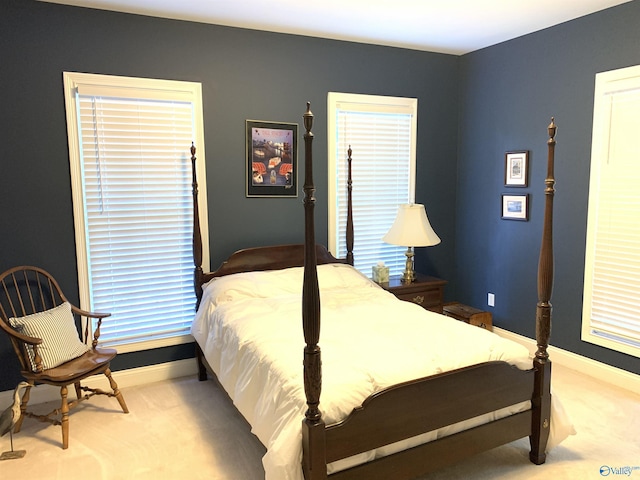 bedroom featuring carpet flooring and baseboards